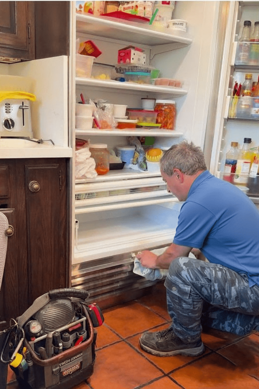 Technician checking internal panel of washing machine