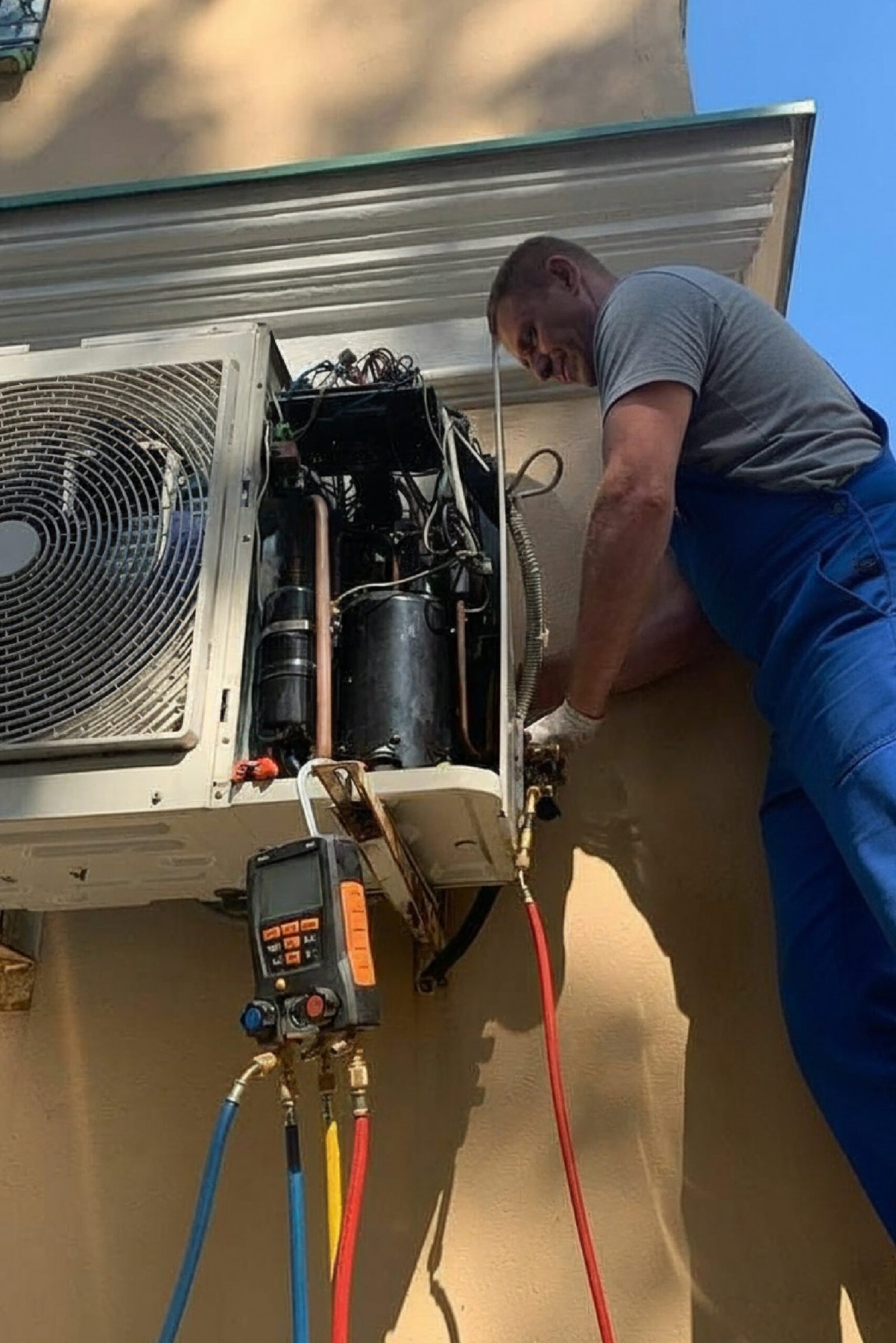 Technician repairing AC unit